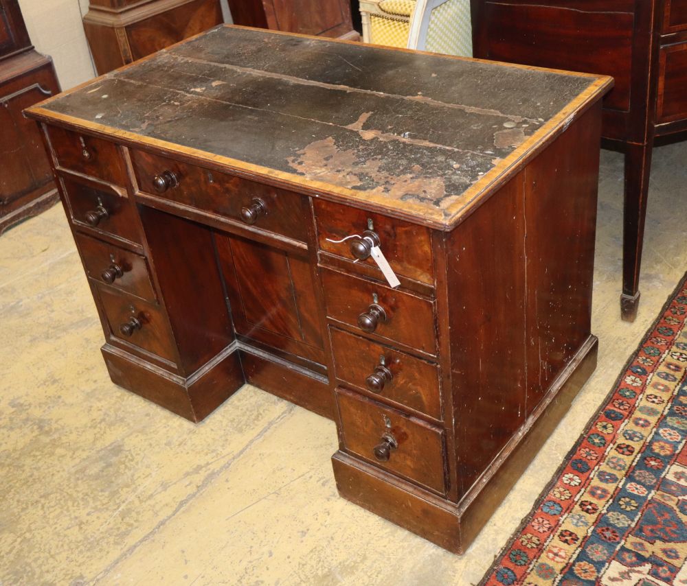 A George IV mahogany kneehole desk, with recessed cupboard, W.115cm, D.60cm, H.76cm